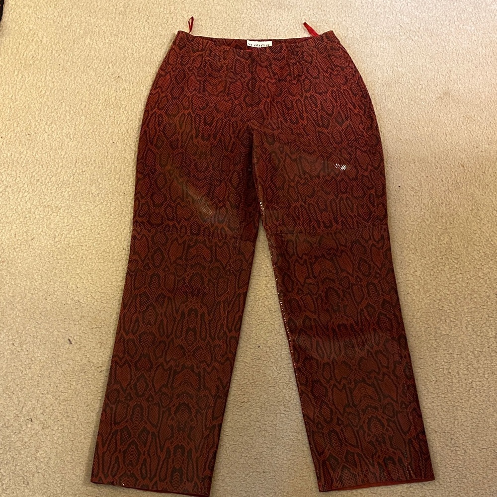 Leather pants, shiny dark red and black snake print, by Scooter, size 38